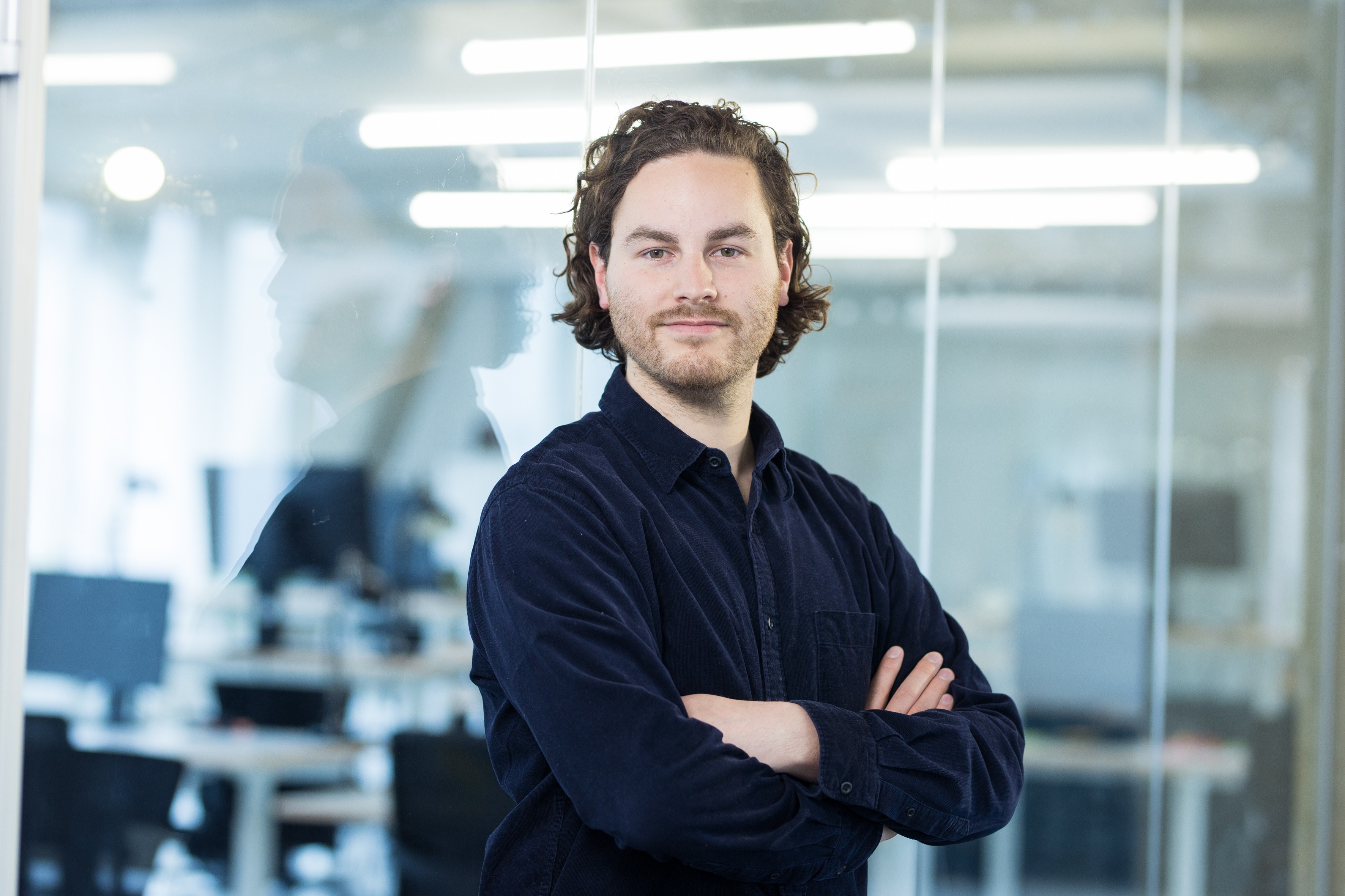 A portrait picture of Joshua Pacheco in the DigitalService office